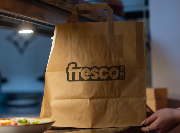 Photo of paper bag with Fresco logo.